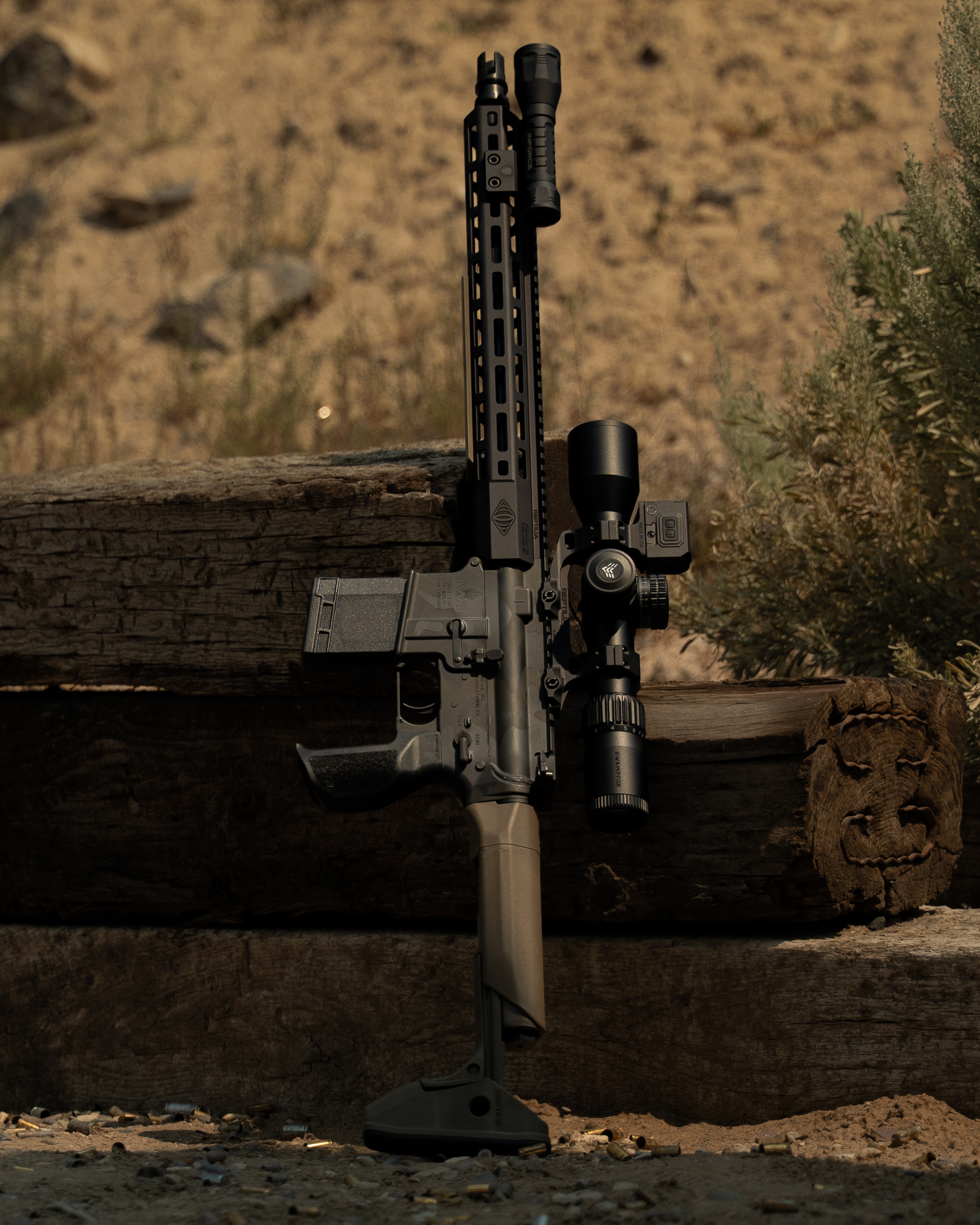 SPR 04 full build, suppressed IWI Zion-15 leaning against a wooden ledge